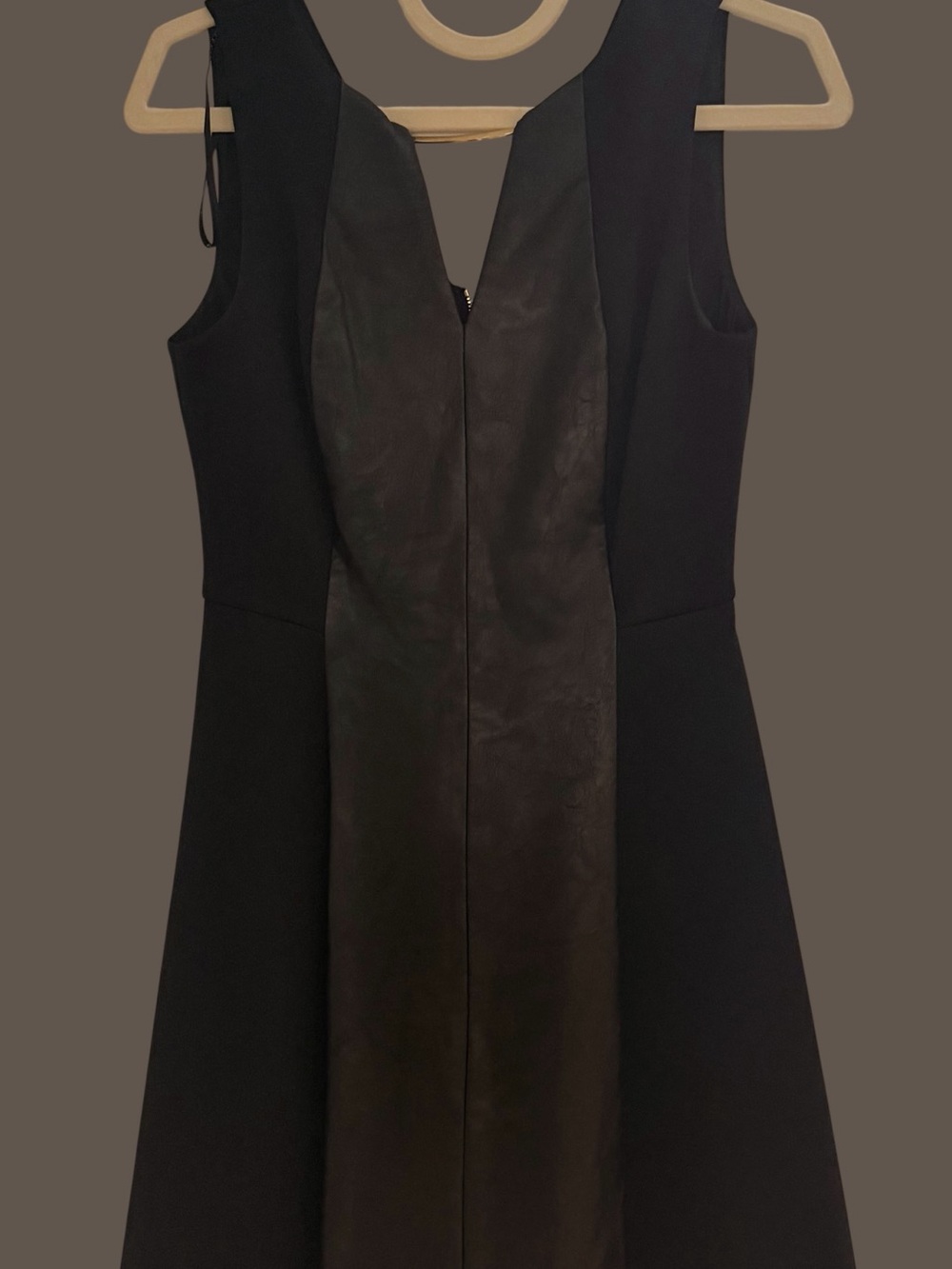 Vince Camuto Black Dress With Faux Leather Middle, and Gold Tone Cross Bar.